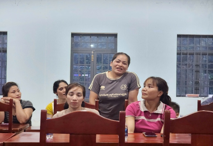 '''''A group of people sitting at a table

Description automatically generated'''''