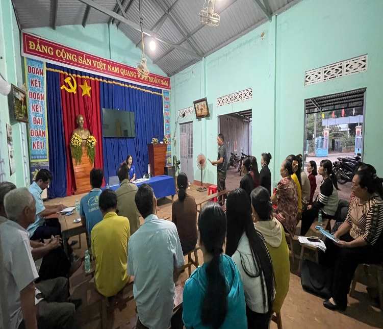 '''''A group of people in a room

Description automatically generated'''''